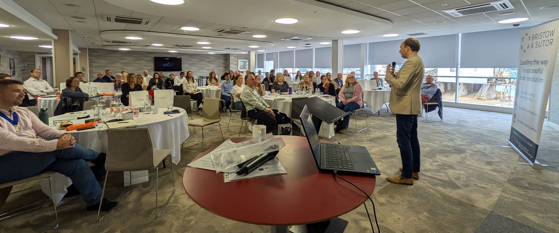 Daniel Fitzhenry speaking on leadership to a full room of around 60 people at the IRRV regional meeting, St Mary's Stadium, Southampton, 5 July 2024