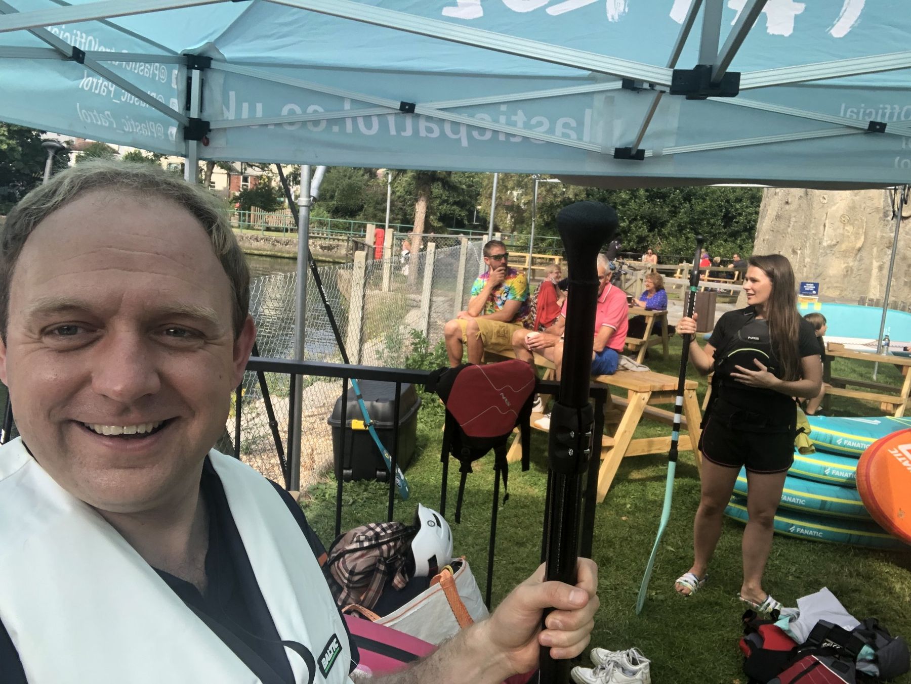 Daniel Fitzhenry smiling under the Plastic Patrol gazebo before the river clean-up