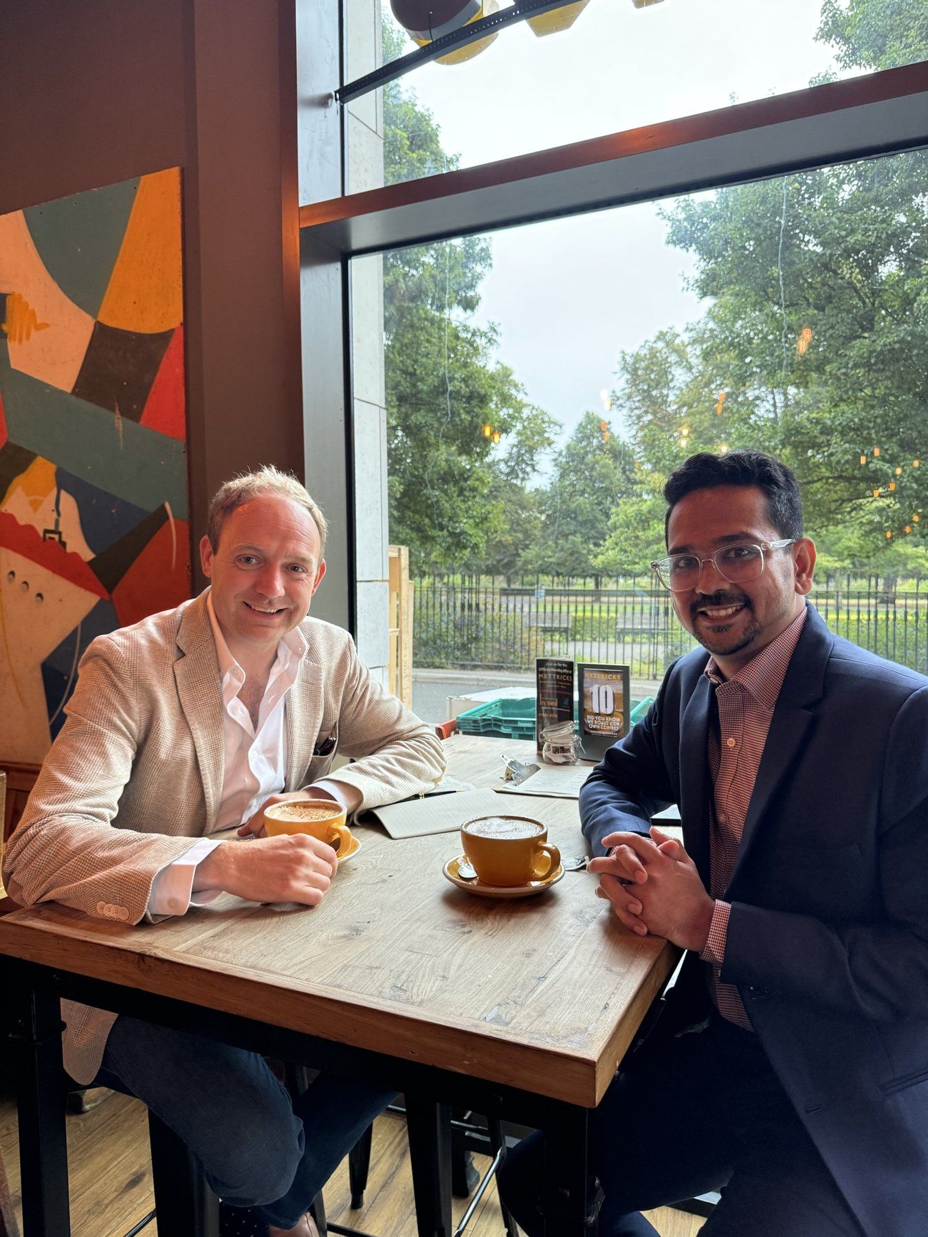 Daniel Fitzhenry in a working session with an advisory client over coffee