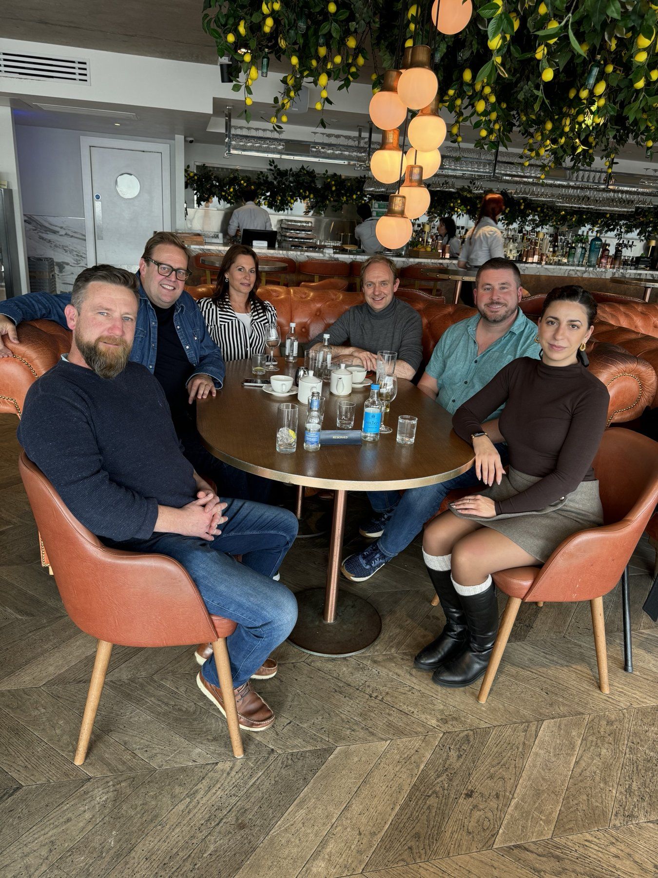 Daniel Fitzhenry with the Charles Edwardson and Elephants Child teams around a table at the Harbour Hotel, Southampton
