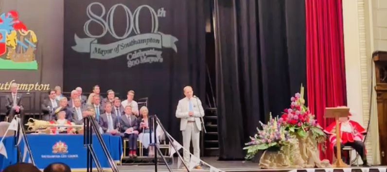 Daniel Fitzhenry speaking on stage at Southampton's Mayor Making ceremony for the city's 800th Mayor, May 2022