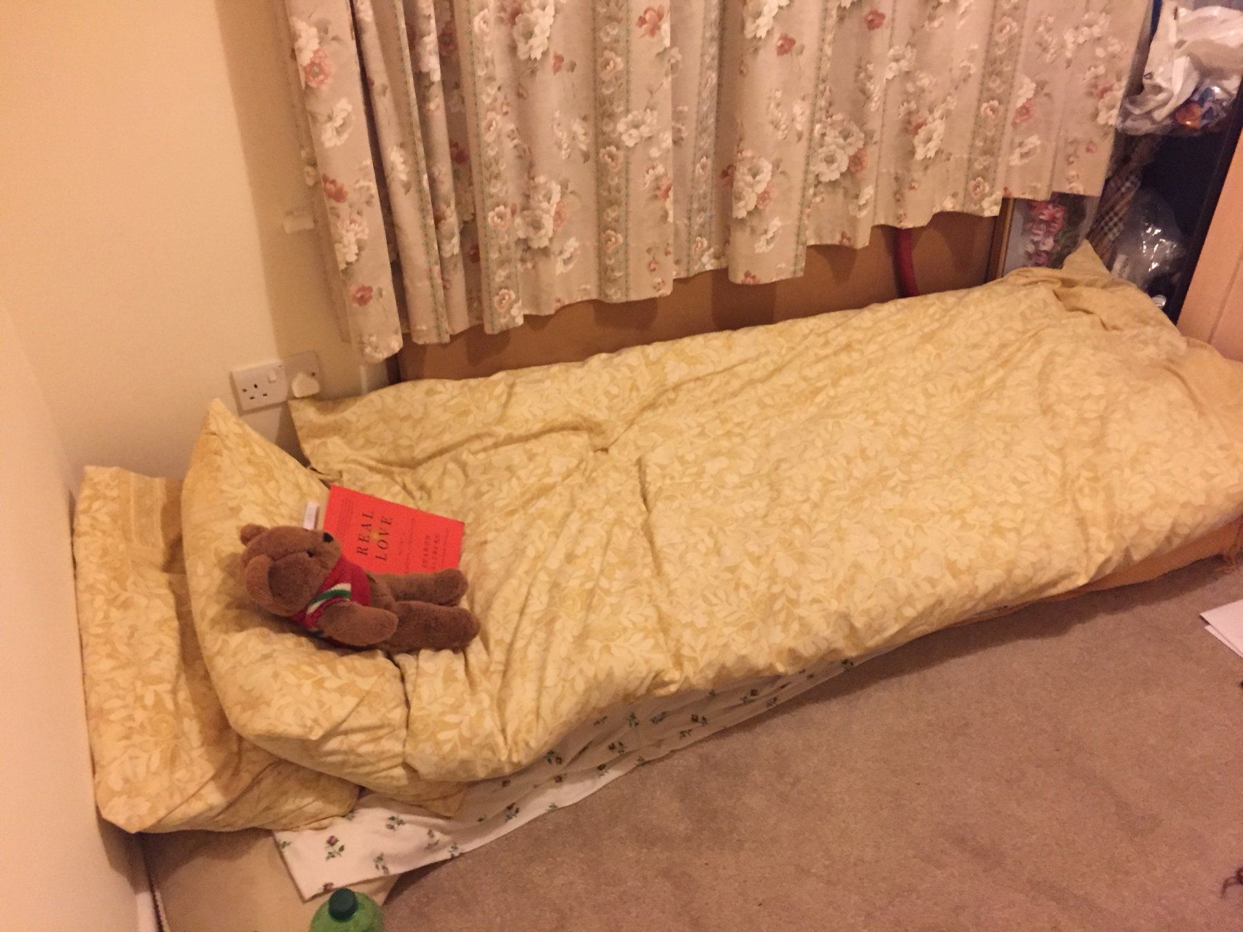 The makeshift bed of cushions and a duvet on the floor of his mum's spare room where Daniel Fitzhenry slept after going bankrupt, 2017